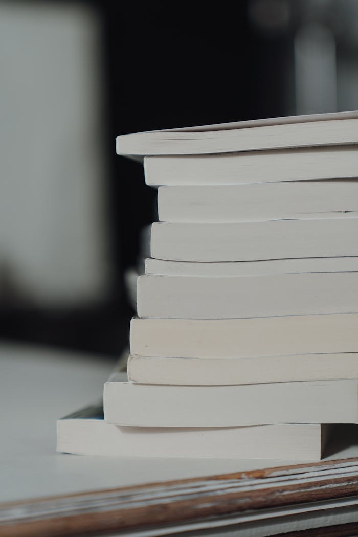 Close-up of stacked books with focus on spines, offering copy space and a minimalist appeal.